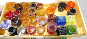 lot 72 image: A fun lot of colorful toothpick holders in Square and Triangle shapes, purple, red, green, gold, blue