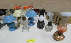lot 83 image: group of 7 small hurricane lamps, tin and clear