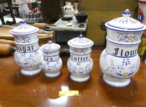 lot 90 image: Very cute Sugar, Flour, Coffee, Tea ceramic canister set.  Flour does have a crack in it, but chances are it will be used for display only anyway