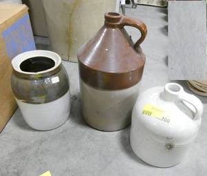 lot 100 image: A couple stoneware whiskey jugs and a canister