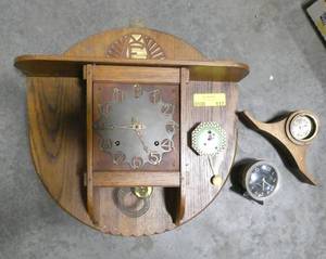 lot 117 image: A unique wall clock and a few small clocks