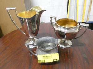lot 125 image: 3 sugar and creamers, I am assuming they are silverplate and pewter