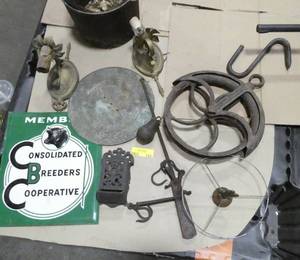 lot 133 image: Cast iron group - nice kettle, match holder, pulley, sundial faceplate, iron sconces, sign