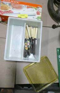 lot 134 image: Vintage glass butter block maybe Butter knives, new electric knife, and glass cutting board