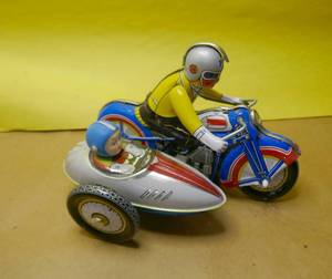 lot 164 image: 2 more tin toys - motorcycle with sidecar and Coast Guard boat pull toy