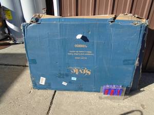 Elliot Creek outdoor love seat & coffee table. Looks new in box. Damaged in shipping. Completeness unknown. As shown.