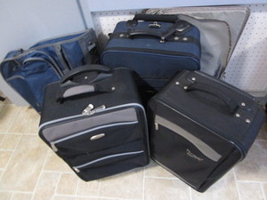 Roller suitcases, 21x11 and 23x1...