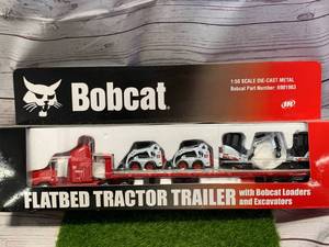 lot 1 image: Bobcat Flatbed Tractor Trailer (Sold $70 on Ebay)