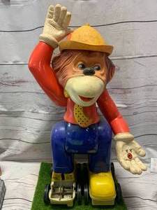 lot 12 image: Vintage Rolling Roller Skating Battery Operated Monkey 23�  Tall