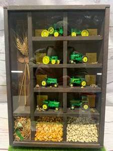 lot 19 image: John Deere Tractor Shadow Box of Vintage Toys 11� x 15�