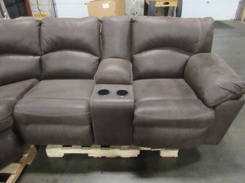 lot 445 image: Signature By Ashley Tambo 2-Piece Reclining Sectional In Canyon - LH RECLINER HAS ISSUES RECLINING AND POPPING THE FOOT REST WITH OUT ASSISTANCE.
