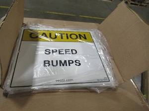 lot 328 image: Vestil 11.75 in. x 9.75 in. Reflective Speed Bump Sign Model # SBS-1012 (Package Contains 10 Signs)