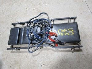 Mechanics dolly, jumper cables...