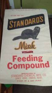 lot 215 image: (2)  50 lb. Mink Feed gunny sacks - excellent