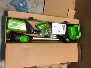 lot 83 image: Greenworks PRO 13 in. 60V Battery Cordless TORQDRIVE Brushless String Trimmer with 2.0 Ah Battery and Charger Customer Returns See Pictures