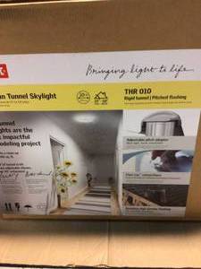 lot 97 image: VELUX 10 in. Sun Tunnel Tubular Skylight with Rigid Tunnel and Pitched High Density Flashing Customer Returns See Pictures 
