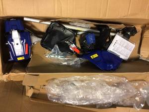 lot 98 image: Badger 26 cc 2-Cycle 2-in-1 Gas Full Crank Straight Shaft Grass Trimmer with Brush Cutter Blade and Bonus Harness Customer Returns See Pictures