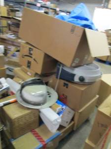 lot 21 image: pallet of unsold and items that nee...