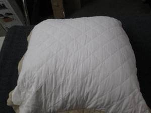 lot 74 image: one white pillow roughly 23 x23 inc...