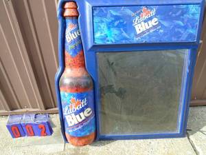 Labatt Blue message board. Used condition. Bottle lights up. 27 x 29. As shown.