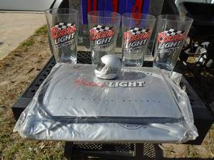 Qty of 4 Coors Light racing glasses with soft side cooler & mini helmet. As shown.