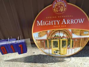 NOS New Belgium mighty arrow tin sign. 19 diameter. As shown.