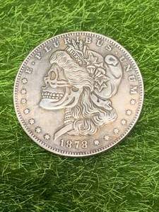 lot 86 image: Morgan Dollar Skull Coin