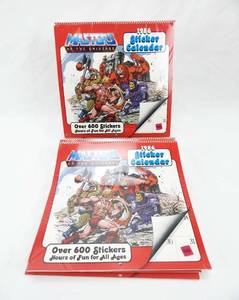 lot 70 image: Set of 11 Vintage 1986 2025 He-Man Masters of the Universe Sealed Sticker Calendars