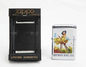 lot 7 image: Vintage 1996 Gil Elvgren Wayward Wind Pin Up Zippo Lighter