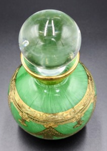 lot 80 image: Green and Gold Accented Glass Perfume Bottle