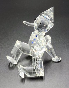 lot 82 image: Pair of Gina Truex Crystal Pinocchio Figurines