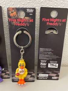 lot 108 image: Funko FNAF Five Nights at Freddys Set of 5 Collectible Figure Keychains.