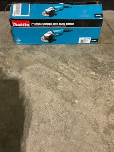 Makita 15 Amp 7 in. Corded Angle Grinder with Grinding wheel, Side handle and Wheel Guard. See Pictures