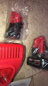 lot 34 image: Milwaukee M12 12-Volt Lithium-Ion 4.0 Ah and 2.0 Ah Battery Packs and Charger Starter Kit