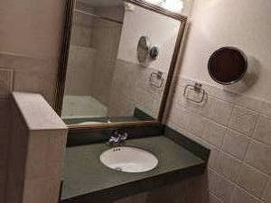 lot 64 image: Beautiful Bathroom Counter w Sink, Large Mirror, Towel Holder, & Magnifying Mirror
