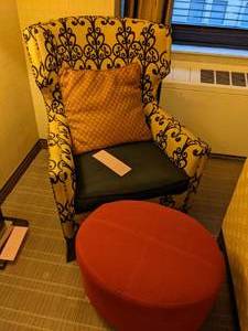 lot 102 image: Wingback Chair in Black & Cream with Round Ottoman and Accent Pillow