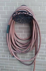 lot 143 image: Heavy Duty Hose with Decorative Wall Hanger
