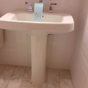 lot 944 image: Tall White Pedestal Sink