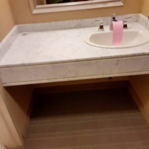 lot 1001 image: Small Marble Vanity with Attached Sink