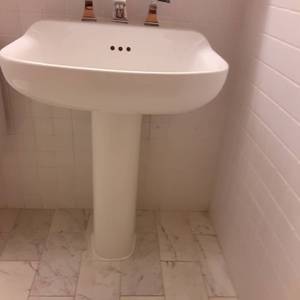 lot 1027 image: Tall White Pedestal Sink
