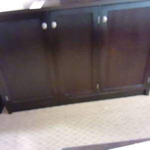 lot 1073 image: Large Heavy Brown 3-Door CabinetTV Stand