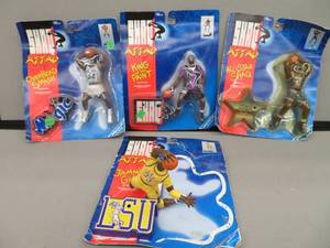 lot 125 image: 4 COLLECTABLE SHAQ FIGURINES