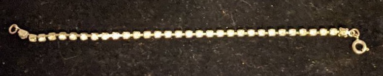 lot 14 image: Sparkling Silver Tennis Bracelet