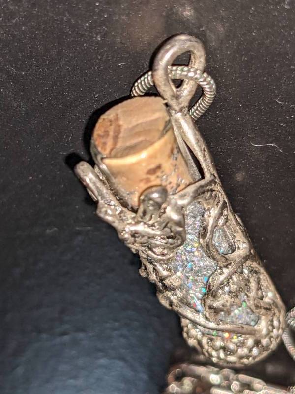 lot 63 image: Tinkerbell Fairy Dust Vial on Chain