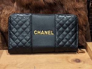 lot 48 image: Chanel Black Quilted Wallet
