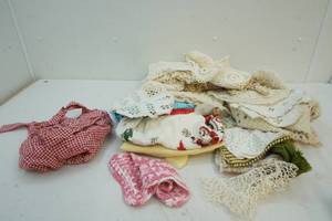 lot 219 image: Doilies, aprons and cloths