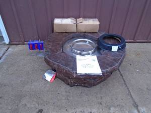 Teamson Home stone look gas fire pit with lava rocks. Was taken out of box for pictures. Appears unused. As shown.