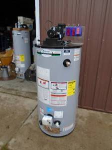 AO Smith 50 gallon power vent gas water heater. Unused. Has minor dents & scratches. Vent housing has been glued. As shown. THIS ITEM HAS A RESERVE.