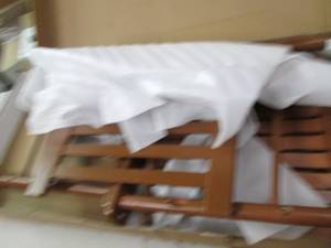 wooden brown rocking chair needs as...