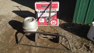 Lawn edging, keg, hand saw and vintage Yardman mower